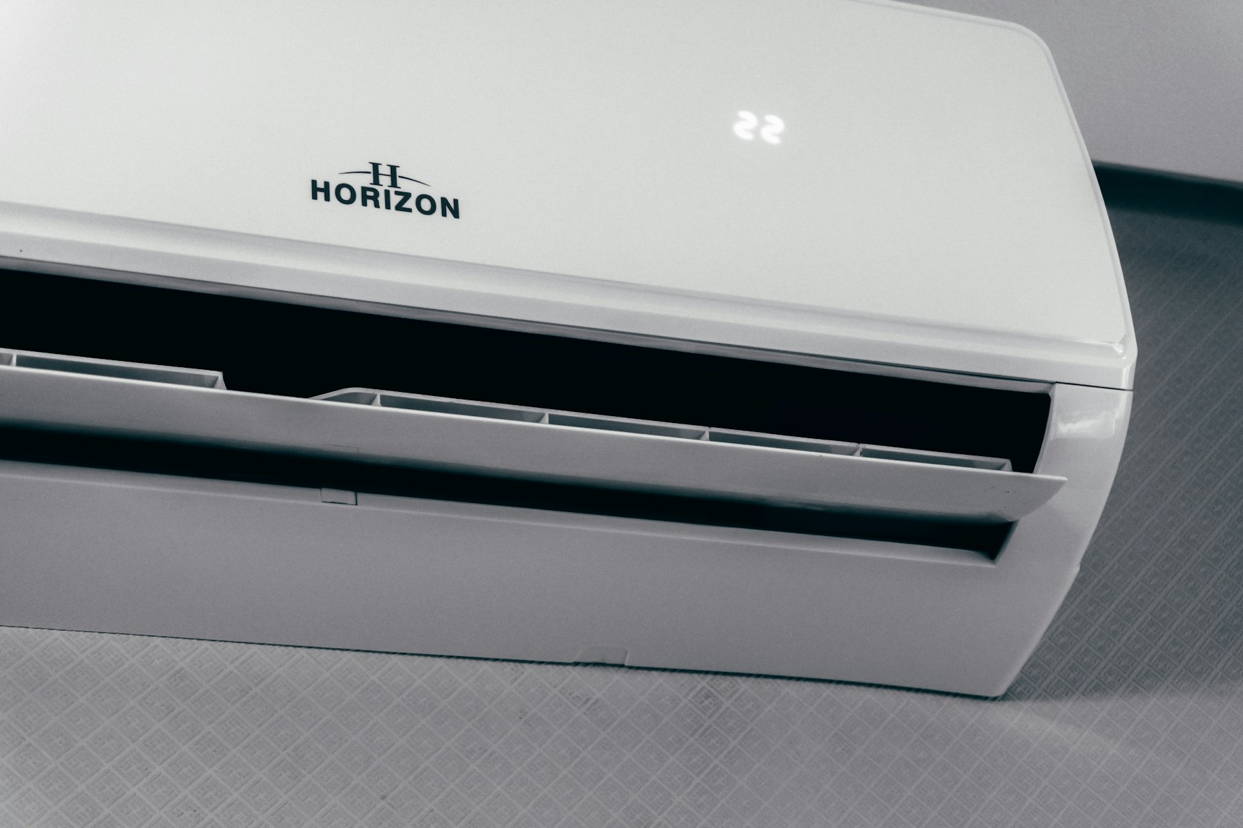 A white wall-mounted indoor unit of a ductless mini-split system